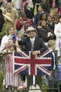 Onlooker displaying Union Jack British Flag