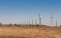 Onshore wind farm, using several horizontal axis turbines, summer day Royalty Free Stock Photo