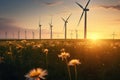 Onshore wind turbines are part of renewable and clean energy on the sunset and blooming fields Royalty Free Stock Photo