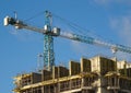 ÃÂ¡onstruction hoisting crane above building house Royalty Free Stock Photo