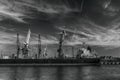 ÃÂ¡ontainer ship in port with harbor cranes in the background black and white Royalty Free Stock Photo