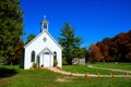 Ontario autumn countryside scene with old wooden chapel and pumpkin lined walk