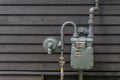 Domestic gas meter on a wall outside a house Royalty Free Stock Photo
