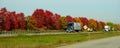 Ontario, Canada - October 27, 2019 - The panoramic view of traffic on the Route 401 highway with stunning colors of fall foliage Royalty Free Stock Photo