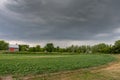 A stormy sky looking over farmland Royalty Free Stock Photo