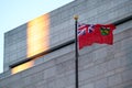 Ontario`s Provincial Flag in front of a wall