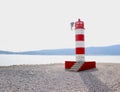 A small lighthouse on the seashore