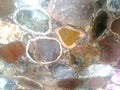 Onyx colourful oval shaped assorted polished stone design texture. Silicate mineral.
