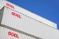 OOCL 40 ft intermodal containers stacked in harbor.