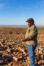 Oombulgurri WA Australia - Sep 2 2014: An Australian indigenous community leader surveys the landscape on the Carson River