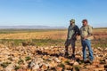 Oombulgurri WA Australia - Sep 2 2014: Two Australian indigenous community leaders explain landscape features to adventure