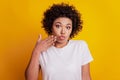 Oops beautiful woman surprised face palm lips look camera on yellow wall