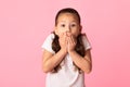 Portrait of amazed asian girl covering her mouth with hands Royalty Free Stock Photo