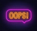 Oops neon sign in the speech bubble on brick wall background. Royalty Free Stock Photo