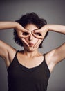 Oops the world looks upside down. Studio portrait of an attractive young woman making a funny face while standing Royalty Free Stock Photo