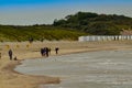 Oosterschelde, the Netherlands, August 2019. The north sea coast: large beaches as far as the eye can see, very few people walking Royalty Free Stock Photo