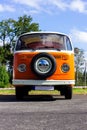 Oostmalle, Belgium - August 19 2023: An orange and white vintage old timer volkswagen split bus, minivan, minibus or camper Royalty Free Stock Photo
