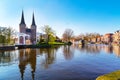 Oostpoort or Eastern Gate dome with canal and house reflection, Delft, Netherlands, Holland