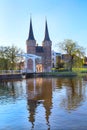 Oostpoort or Eastern Gate dome with canal and house reflection, Delft, Netherlands, Holland