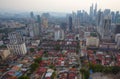 op view of misty Kuala Lumpur city skyline with Petronas twin towers shot in the morning at sunrise Royalty Free Stock Photo