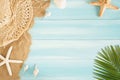 Op view of sea straw hat and sea shells on the sea sand on a blue wooden background, Summer concept on empty. Palm leaf blue wood