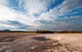 Opal Pool under cloudscape in the Midway Geyser Basin in Yellowstone National Park in Wyoming Royalty Free Stock Photo