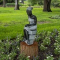 Opal stone sculpture titled Bookreader by Jonothan Mhondorohuma in the Fort Worth Botanic Garden. Royalty Free Stock Photo