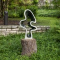 Opal stone sculpture titled Unwinding by Edmore Sango in the Fort Worth Botanic Garden. Royalty Free Stock Photo