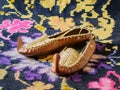 Opanci, traditional Serbian leather folk shoes, kilim flat-woven handmade rug. Royalty Free Stock Photo