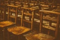Opaque Old Wooden Chairs in Row in a Church Royalty Free Stock Photo