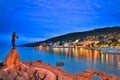 Opatija by night with girl with Seagull