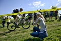 Opava, Czech Republic, 16 May, 2015, Editorial photo of photographer (woman) who take photo on bike race, Opava, Czech Republic