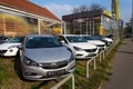 Opel cars in front of dealership building