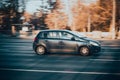 Opel Corsa D car on the city road. Fast moving old rusty auto on Moscow streets. Vehicle driving along the street in city with