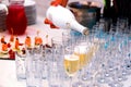 Open air buffet table with glasses of champagne and snacks Royalty Free Stock Photo