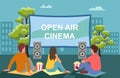 Open air cinema. Movie night with friends. Watching film on big screen with sound system. Open air cinema, outdoor movie