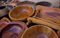 Open-air folk art fair: handicrafts made of wood, a set of dishes.