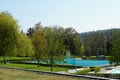 Open air pool in Urdorf, Switzerland in spring, with our water in the big pool for swimmers Royalty Free Stock Photo