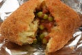 An open arancino showing the rice and ragÃÂ¹ stuffing
