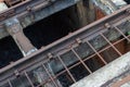 Open area underneath elevated train tracks, industrial textures