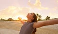 Open arms girl at sunset caribbean beach