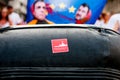 Proactiva open arms ngo sticker on rubber dinghy boat during public protest against italian far right politics and politicians