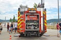 Open back side of red German fire truck with water supply connection