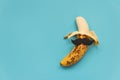 Open bad banana with black paper mustache. Sexually transmitted diseases concept Royalty Free Stock Photo