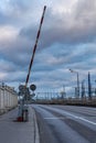 open barrier stands on an empty roadway Royalty Free Stock Photo