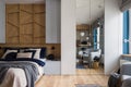 Open bedroom in stylish studio apartment