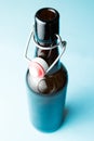 Open beer bottle,  on blue background Royalty Free Stock Photo