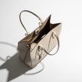 Open Beige Leather Tote Bag with Gold Hardware on a White Background with Shadow handbag Royalty Free Stock Photo