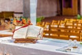 open Bible on the altar of Catholic Church