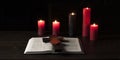 Open Bible book on a wooden table. The cross of Jesus is wooden. Calvary Royalty Free Stock Photo